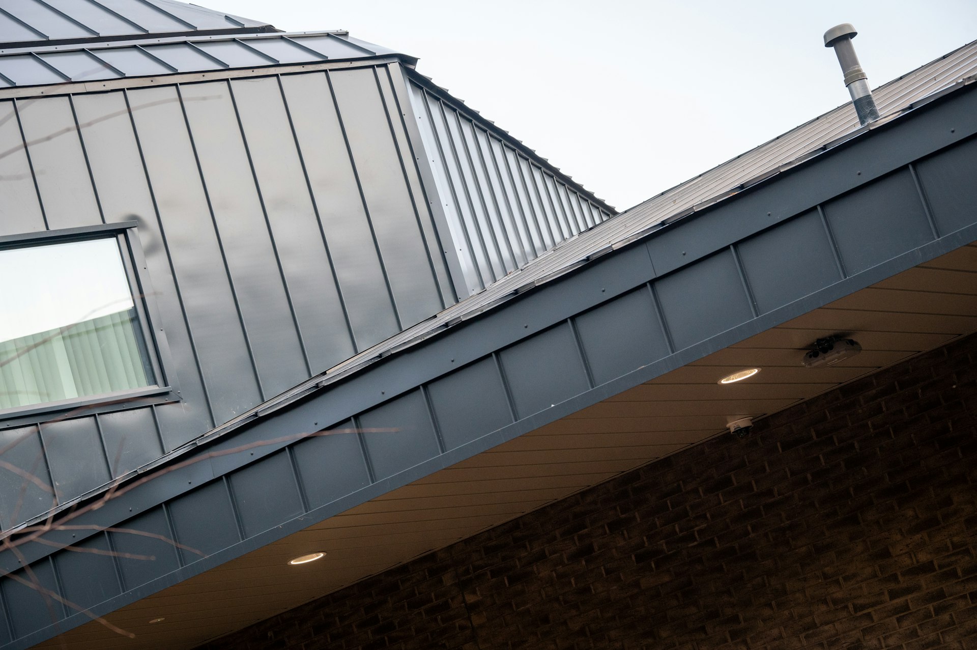 Standing-seam metal roof installation on contemporary architecture home in Morristown NJ