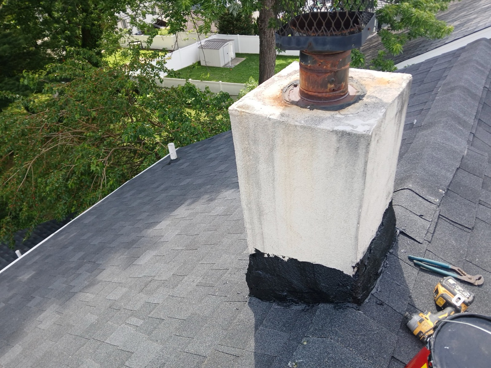 New chimney flashing sealed against charcoal architectural shingles on a Richwood, NJ roof replacement