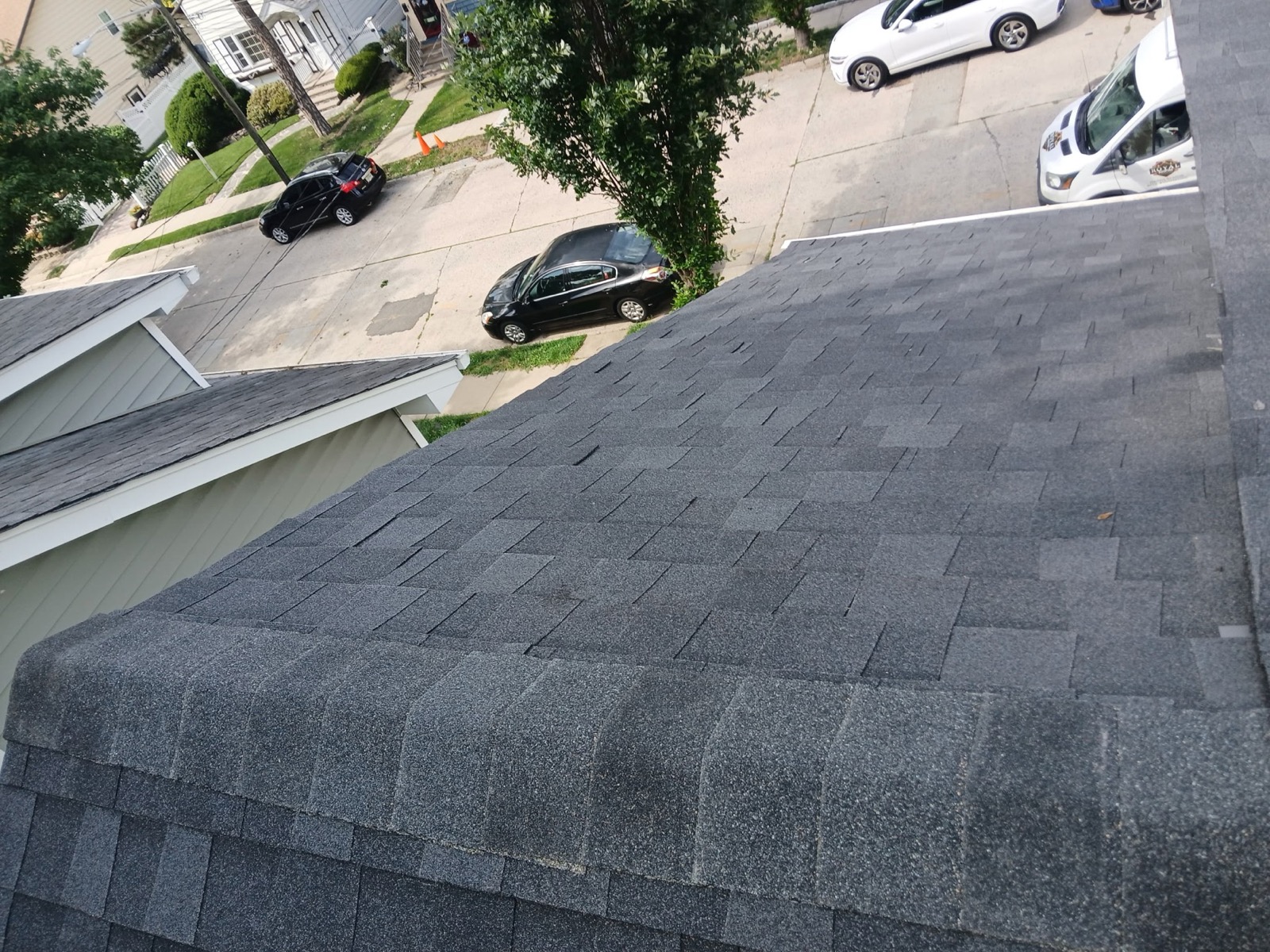 Completed charcoal architectural shingle roof with clean hip and ridge lines in Richwood, NJ